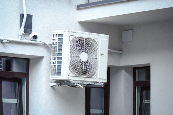 reverse cycle aircon outdoor unit installed on wall